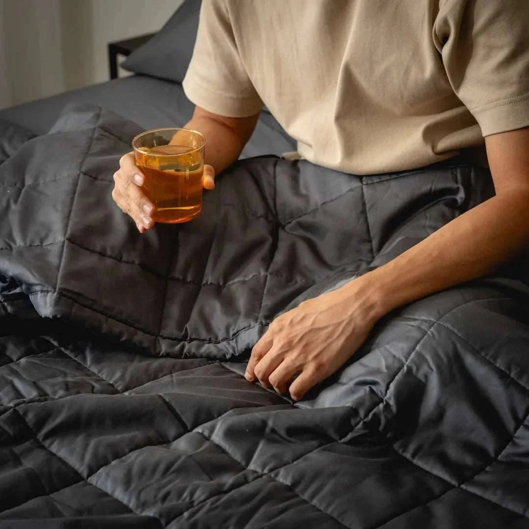 A premium lifestyle view of the Kapas Luxe Cotton Quilt Ed Comforter, the best breathable long-staple cotton bedsheets for tropical weather in Singapore, keeping you fresh all night.