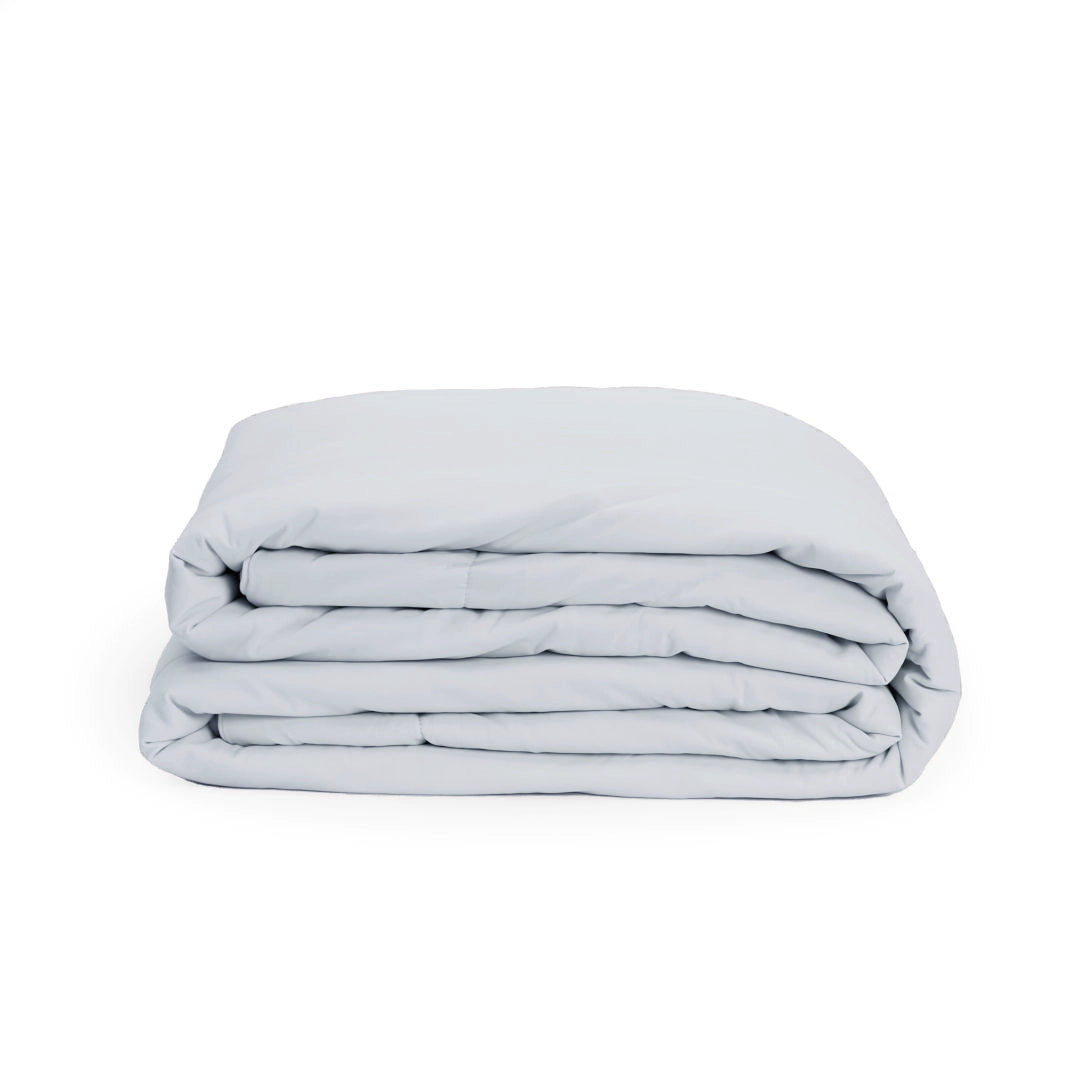 Nimbus Folded light gray blanket on a white background